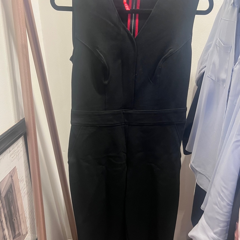 SPANX Black Garment with Red Brand Tag